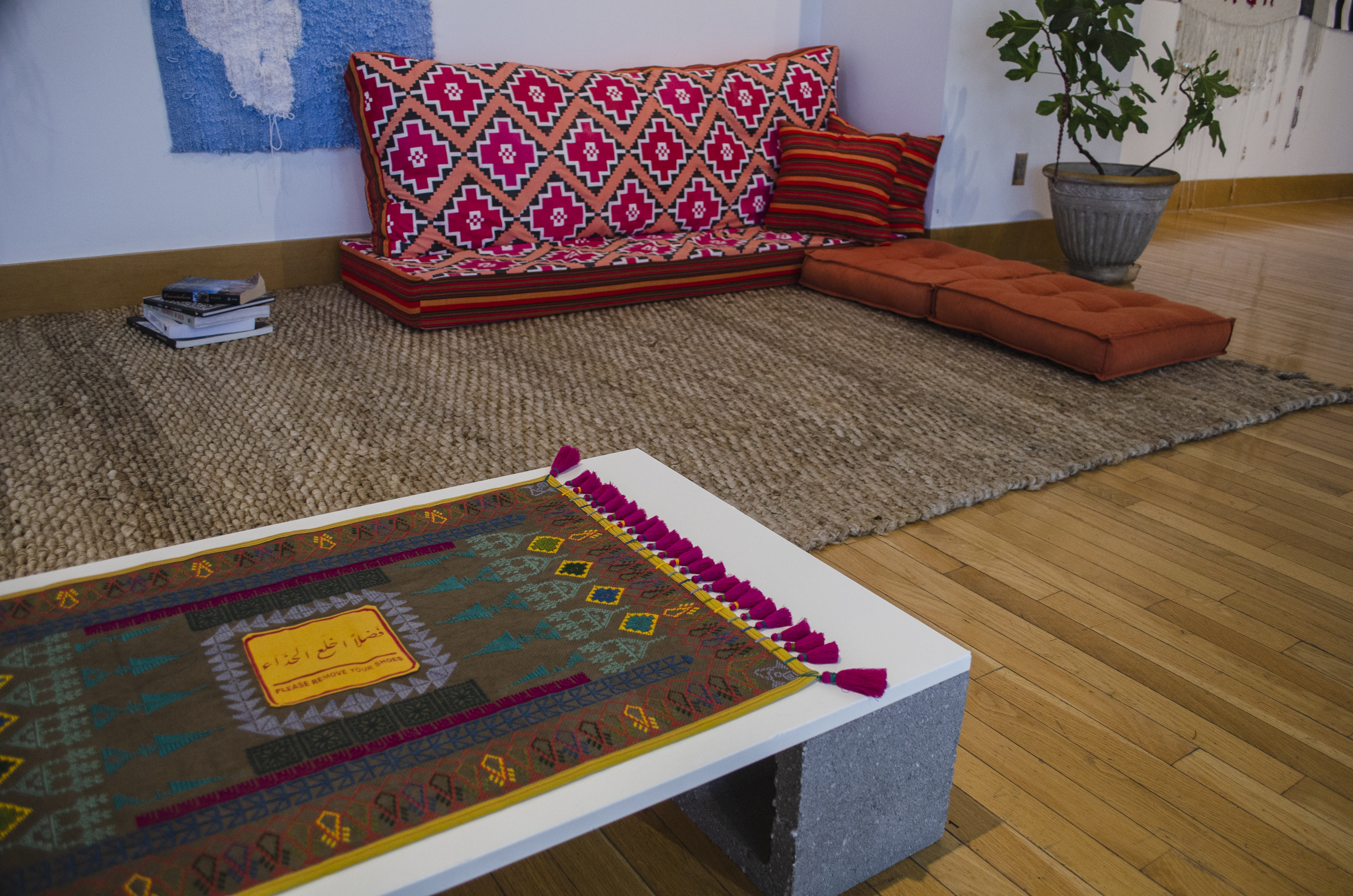 close-up of textile pieces arranged on the floor of The Gallery at The Kranzberg